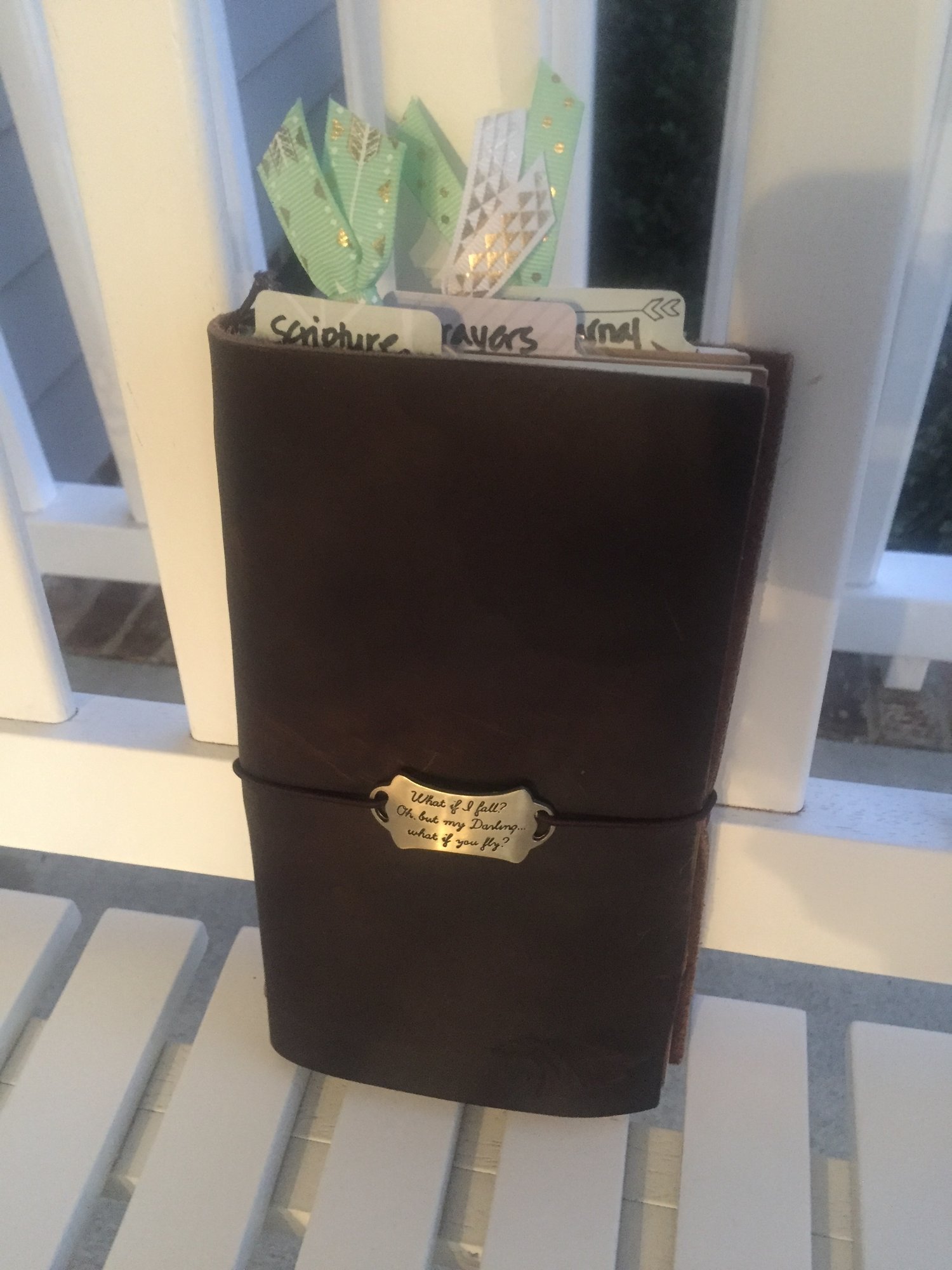 Leather journal with section labels such as Scripture and prayers